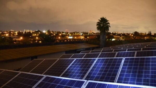 Solar panel array at dusk promoting renewable energy and sustainable living.