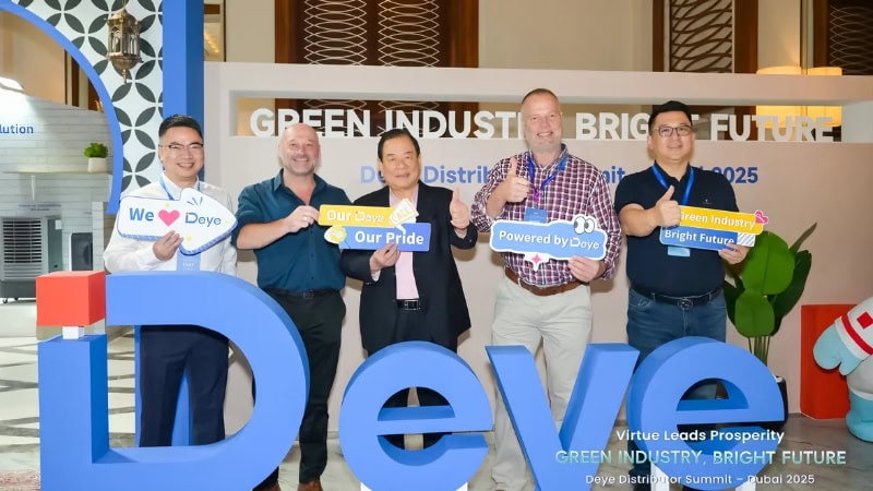 An inspiring group at the Deepblue summit promoting green industry, sustainability, and bright futures with signs emphasizing pride and eco-consciousness.